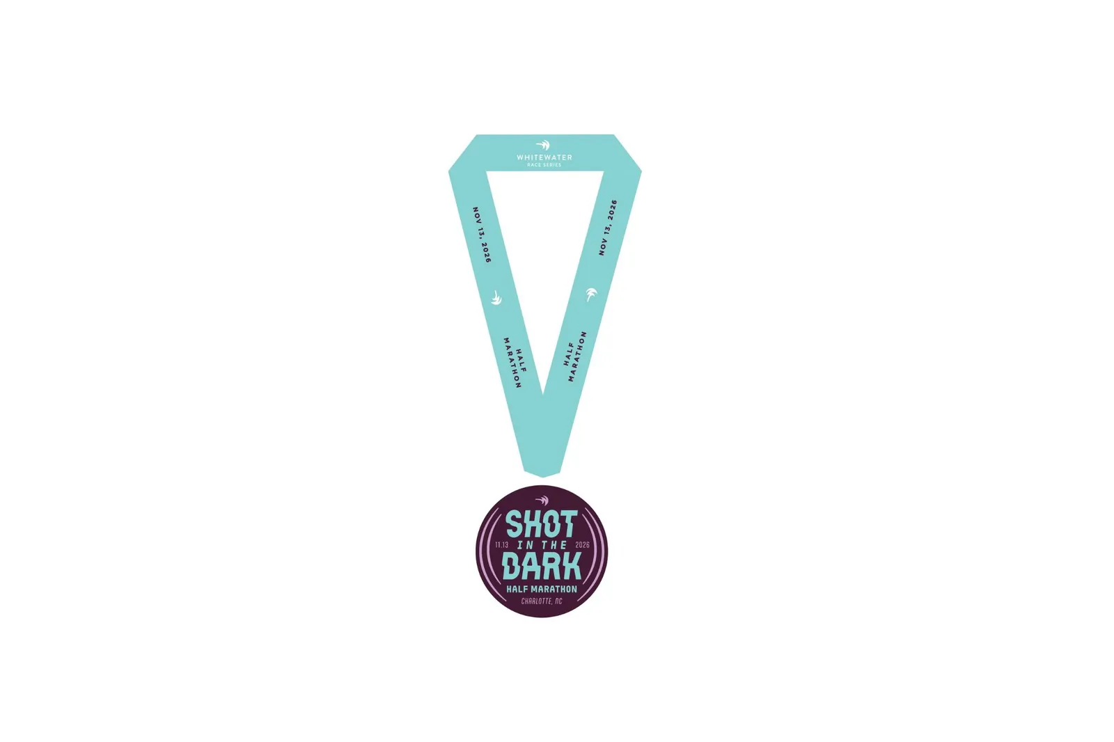 A race medal for the 'Shot in the Dark Half Marathon' with a teal ribbon.