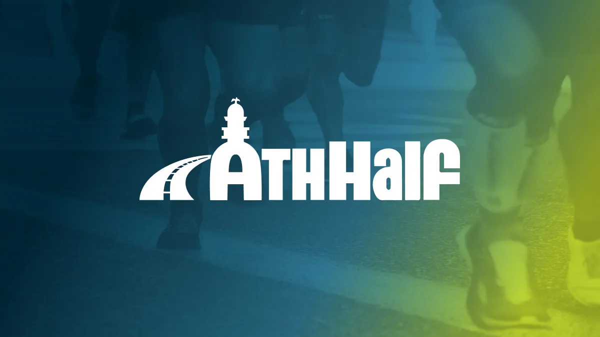 Runners' legs on a road with the AthHalf logo overlaid.