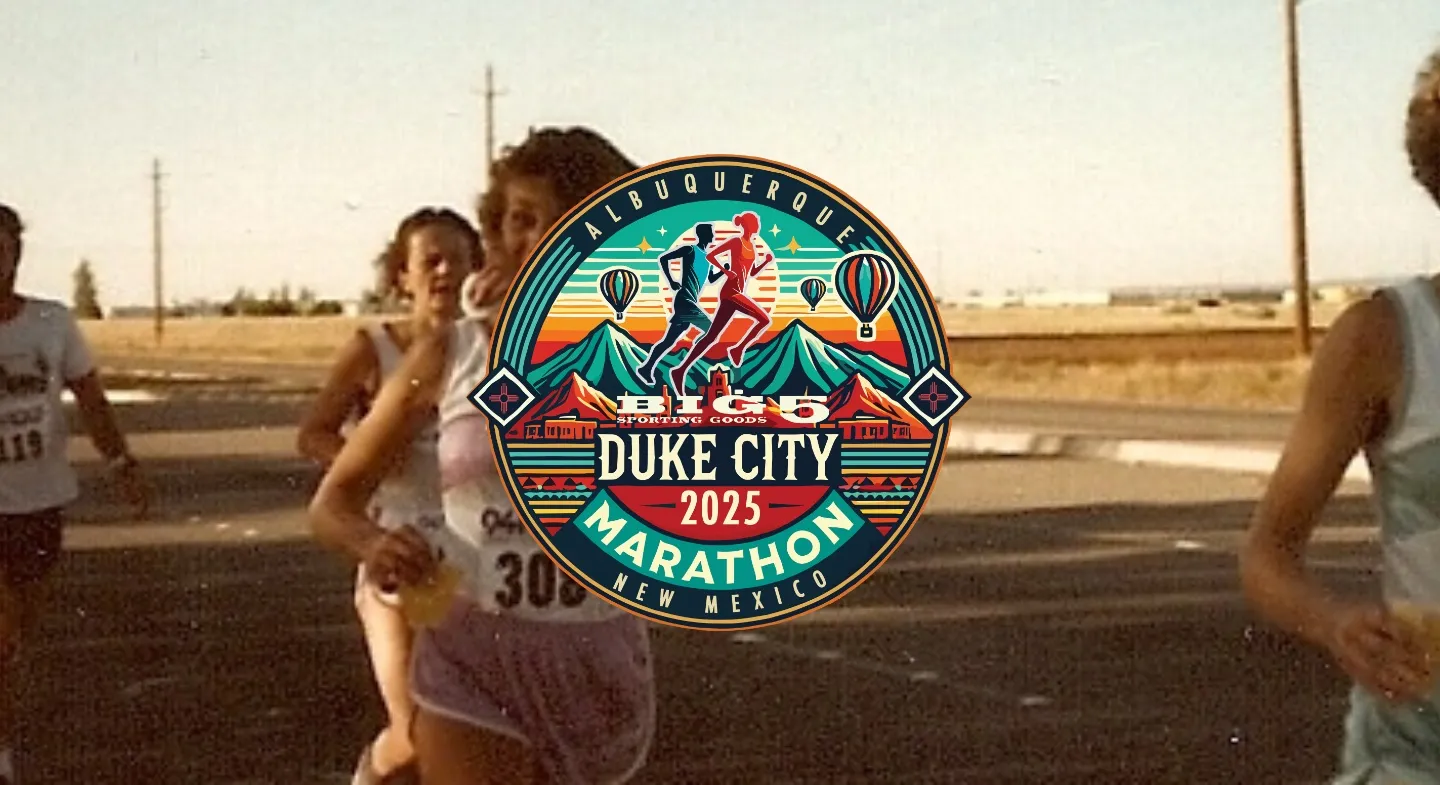 Runners participating in the Duke City Marathon, with the race logo prominently displayed over the image.