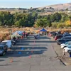 Start line area with tents, cars, and people preparing for the race.