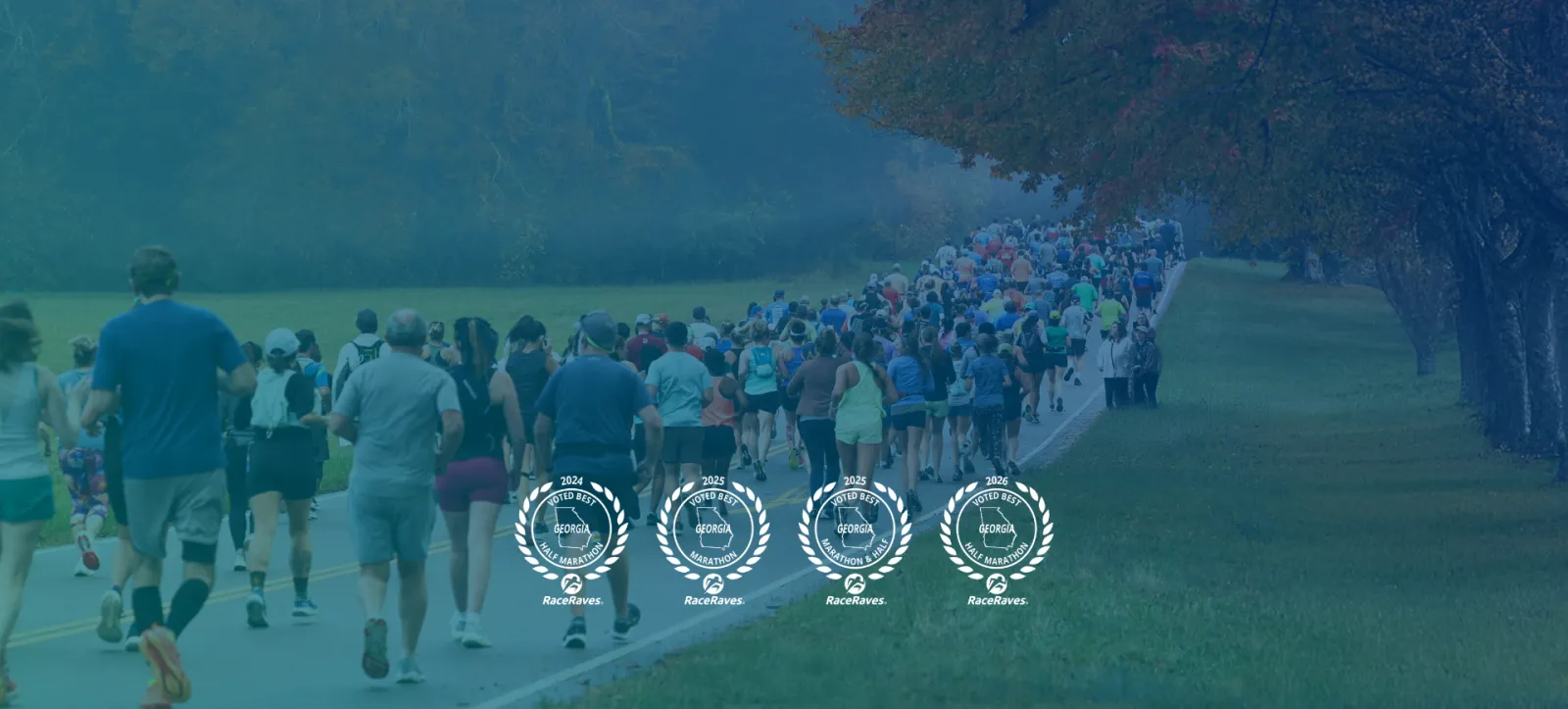 A large group of runners on a road lined with trees, with several 'Voted Best' awards displayed.