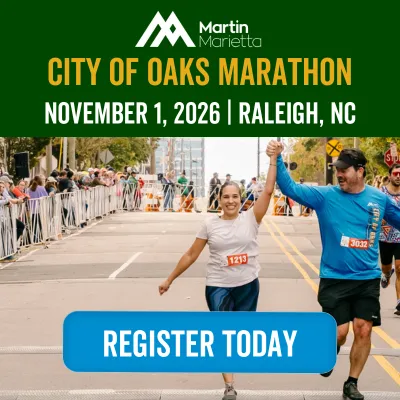 A male and female runner cross the finish line, holding hands and celebrating, with the City of Oaks Marathon branding and a 'Register Today' button overlaid.