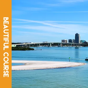 Scenic view of the Clearwater Running Festival course with a bridge, city skyline, and waterfront.