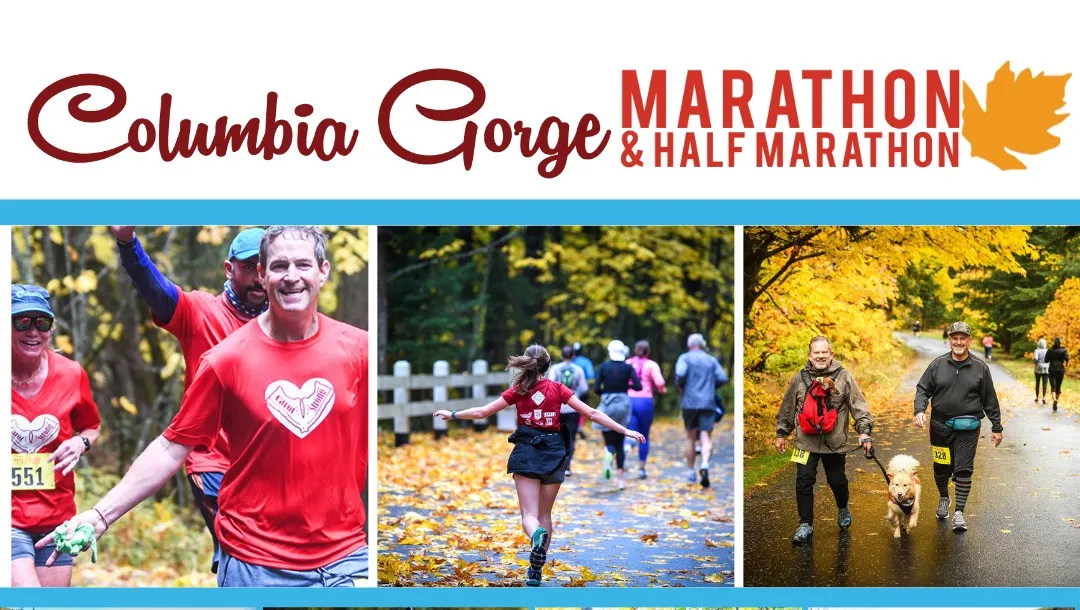 Runners participating in the Columbia Gorge Marathon & Half Marathon during autumn, with colorful fall leaves on the course.