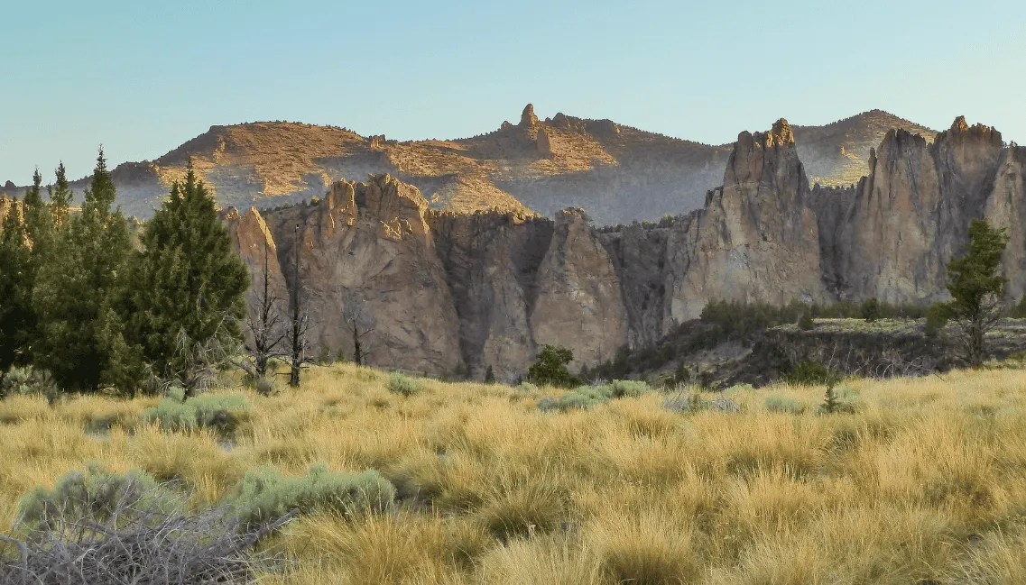 Scenic view of rocky formations and dry grass under a clear sky, likely part of the Dirty Half Marathon OR course.
