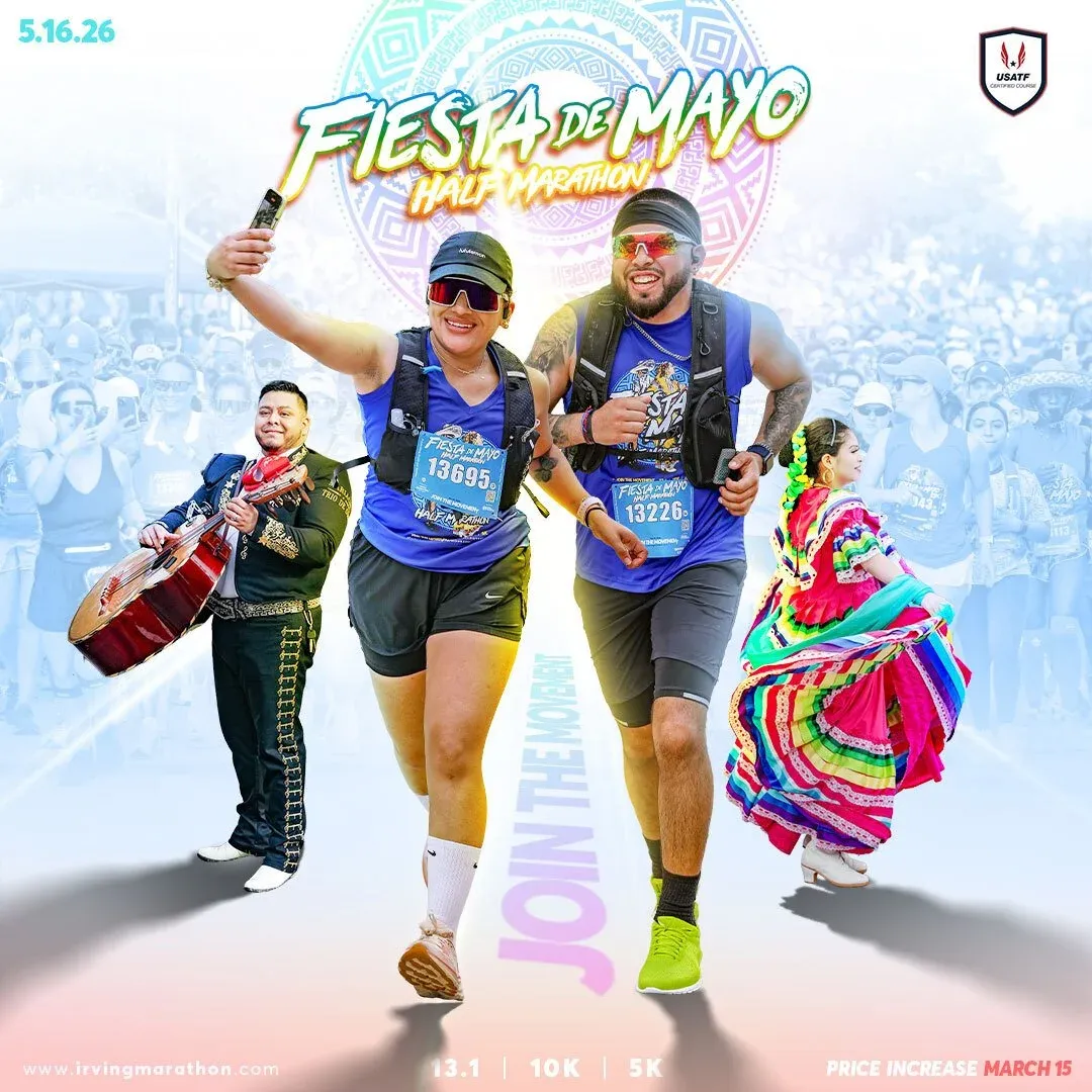 Runners participating in the Fiesta de Mayo Half Marathon, with a mariachi musician and a dancer in traditional attire, celebrating the event.