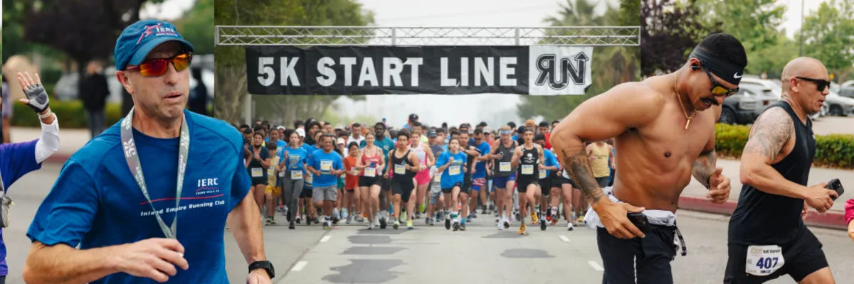 Runners at the start line of a 5K race, with a banner overhead and participants in the foreground and background.