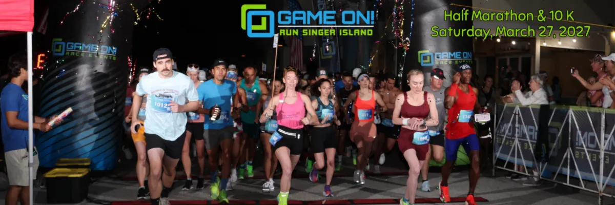 Runners starting the Game On! Run Singer Island Half Marathon & 10K with confetti in the air.