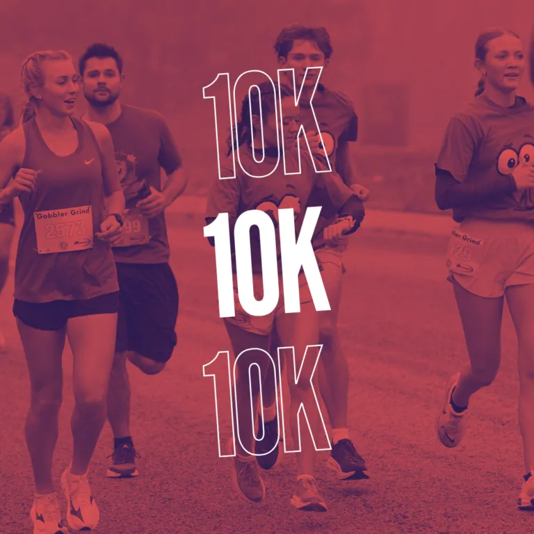 Runners participating in the Gobbler Grind 10K race, with large white text overlaying the image.