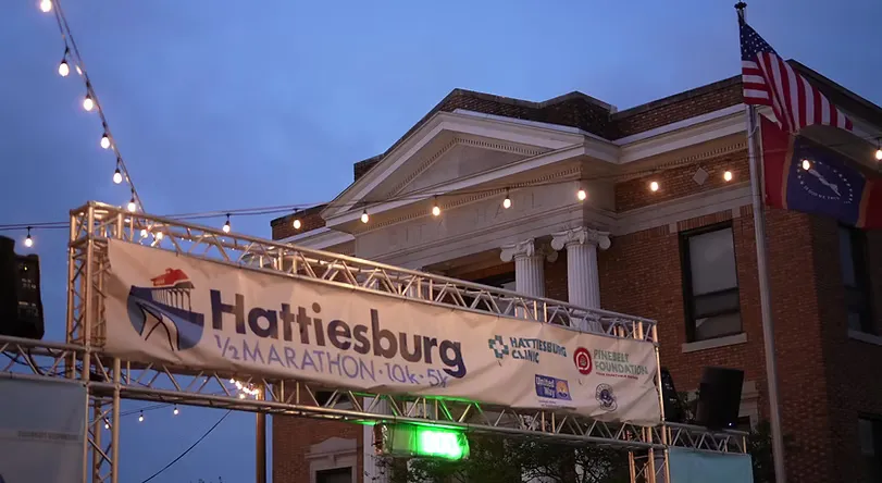 Hattiesburg Half Marathon start/finish line banner in front of City Hall.