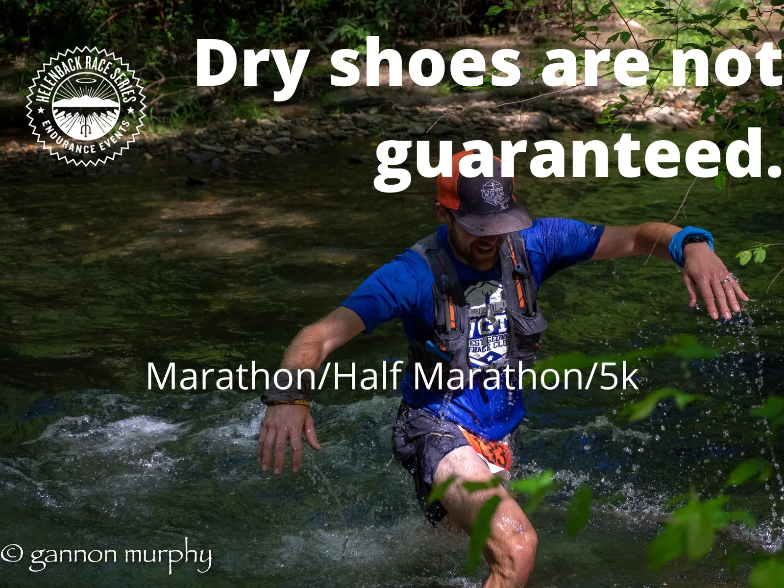 A runner splashes through a shallow stream during a race, with the text 'Dry shoes are not guaranteed. Marathon/Half Marathon/5k' overlaid on the image.