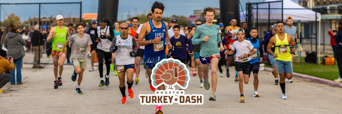 Runners starting the Houston Turkey Dash race, with a graphic of a turkey and the race name overlaid.