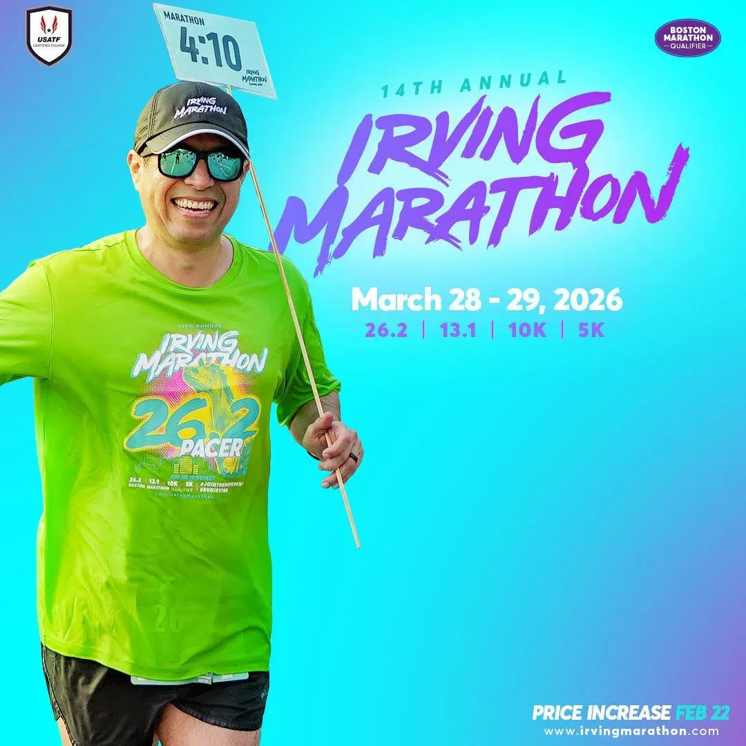 A smiling man wearing a green 'Irving Marathon 26.2 Pacer' shirt and a baseball cap holds a sign with '4:10' on it, advertising the 14th Annual Irving Marathon on March 28-29, 2026.