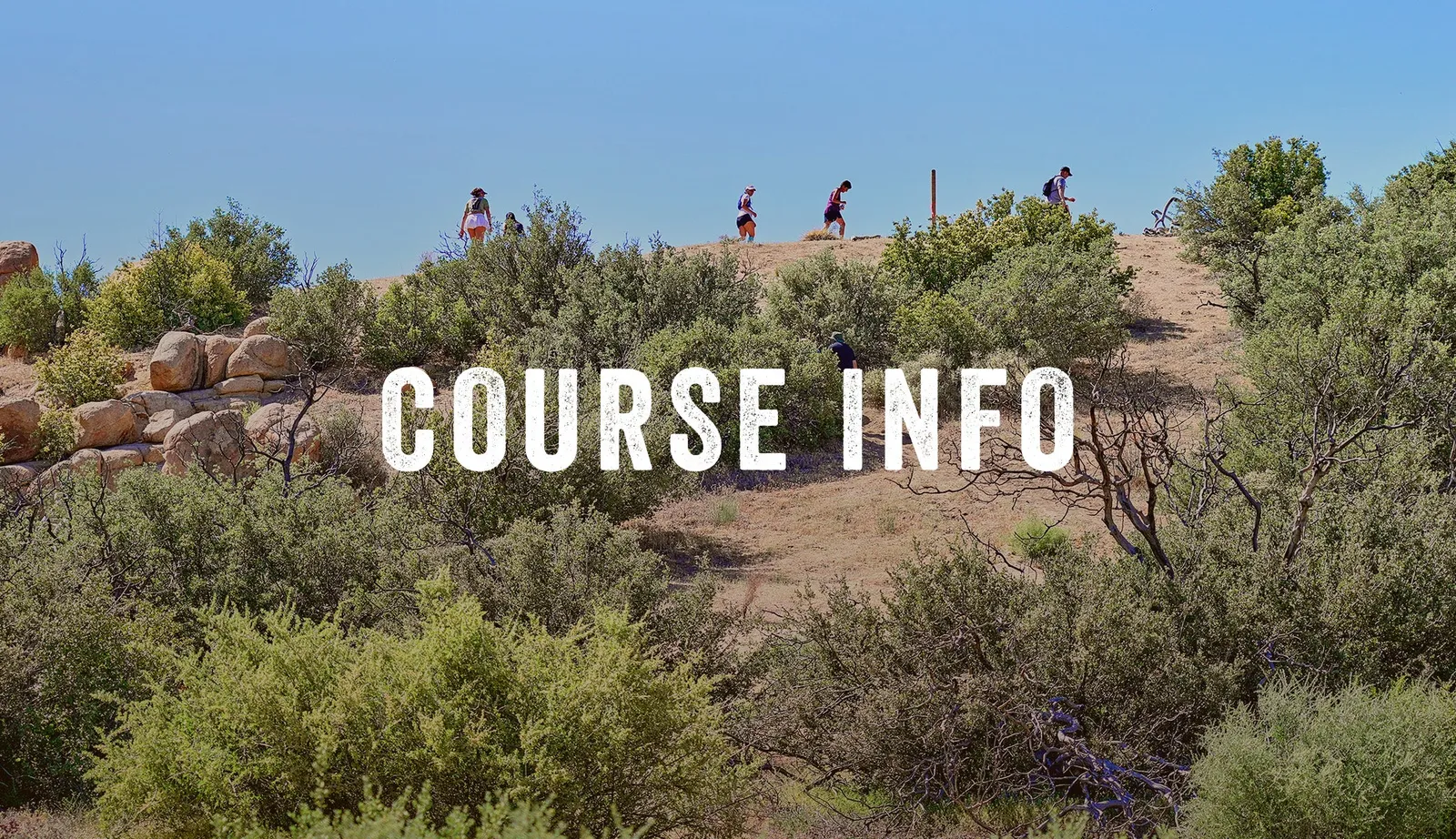 People hiking on a scenic trail with 'COURSE INFO' text overlay.