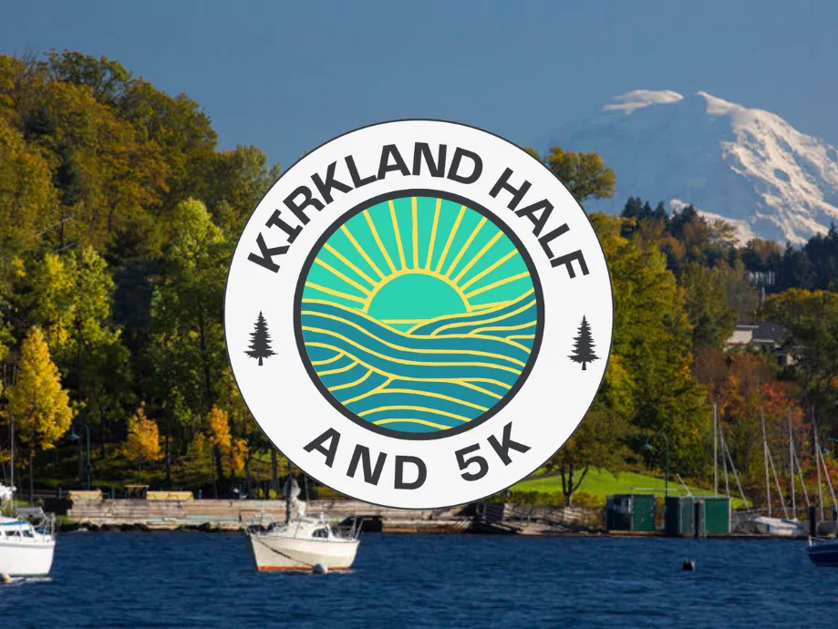 Scenic waterfront view with a mountain in the background and the Kirkland Half and 5K race logo.
