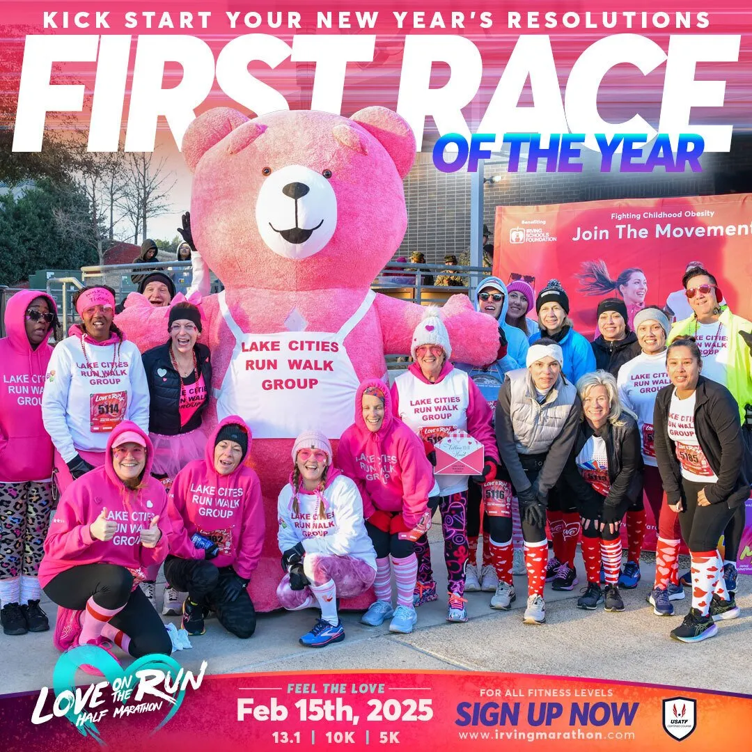 A group of runners in pink attire posing with a giant pink teddy bear at the Love on the Run Half Marathon.