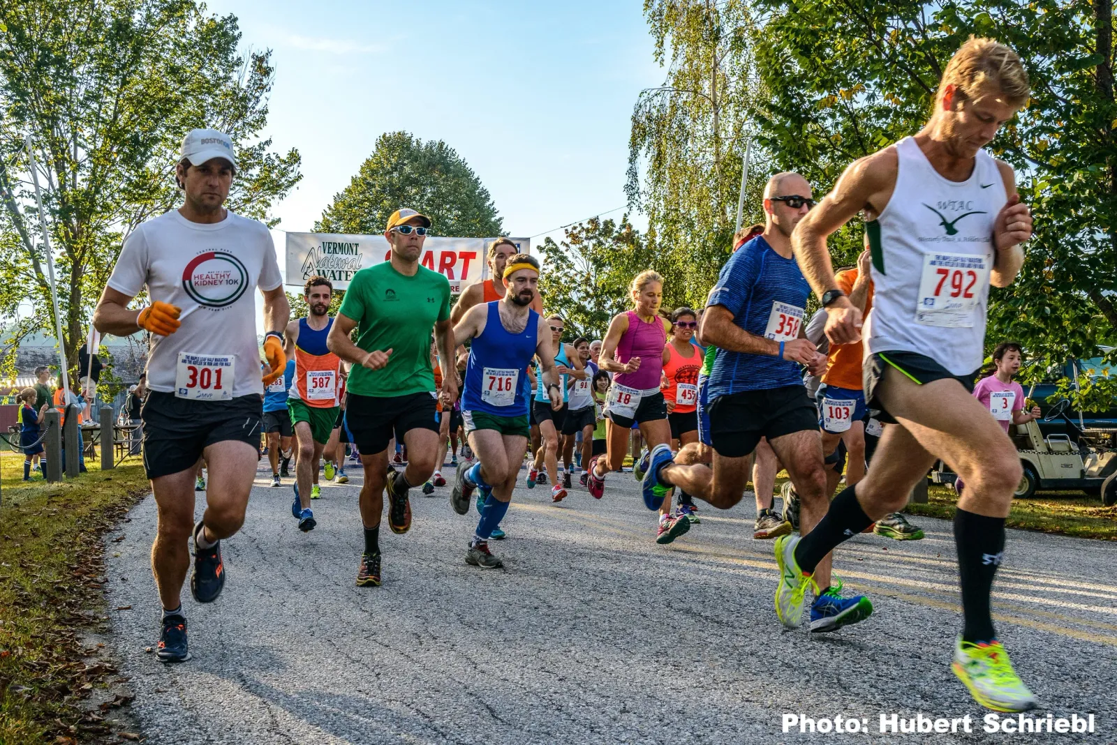 Runners starting the Maple Leaf Half Marathon, with several participants in the foreground and a 'START' banner in the background.