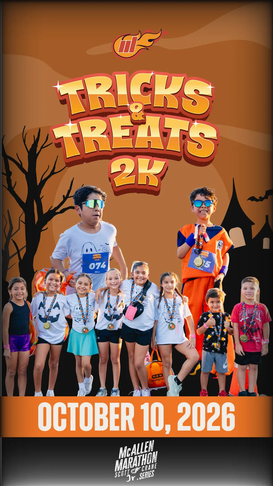 A group of children, some wearing medals, pose for a photo at the McAllen Marathon Tricks & Treats 2K event on October 10, 2026.