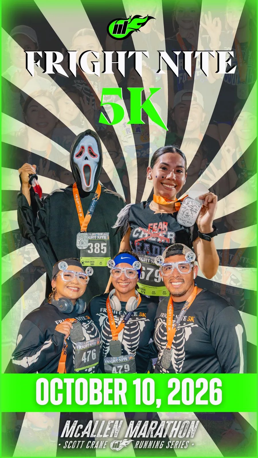 A group of runners, some in costumes, smiling and holding up their race medals after completing the Fright Nite 5K on October 10, 2026.