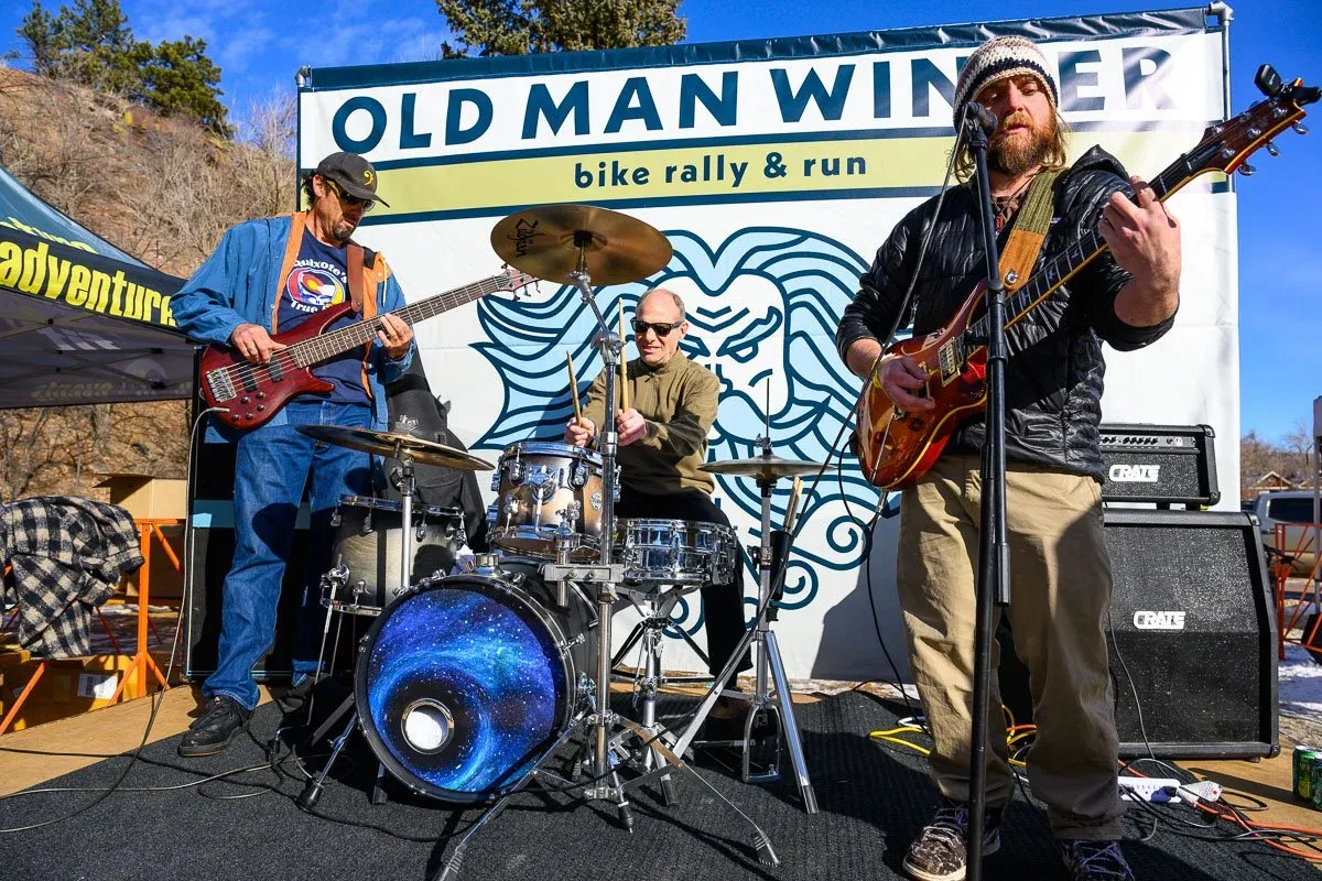 A band plays music on a stage at the Old Man Winter Bike Rally & Run event.