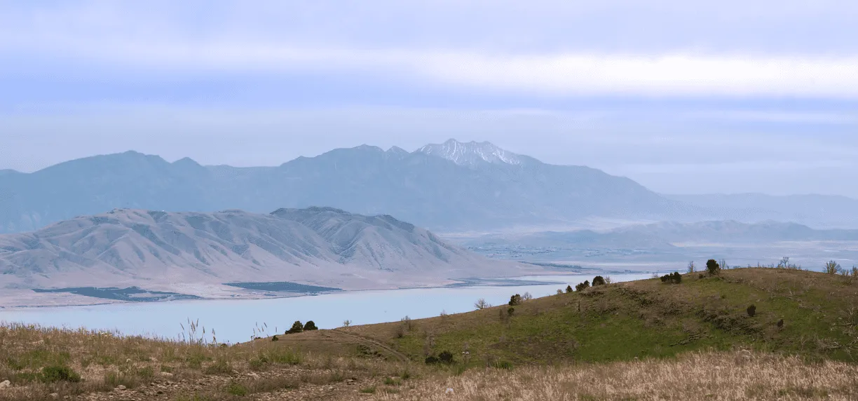 Scenic view of mountains and a lake, likely part of the race course.