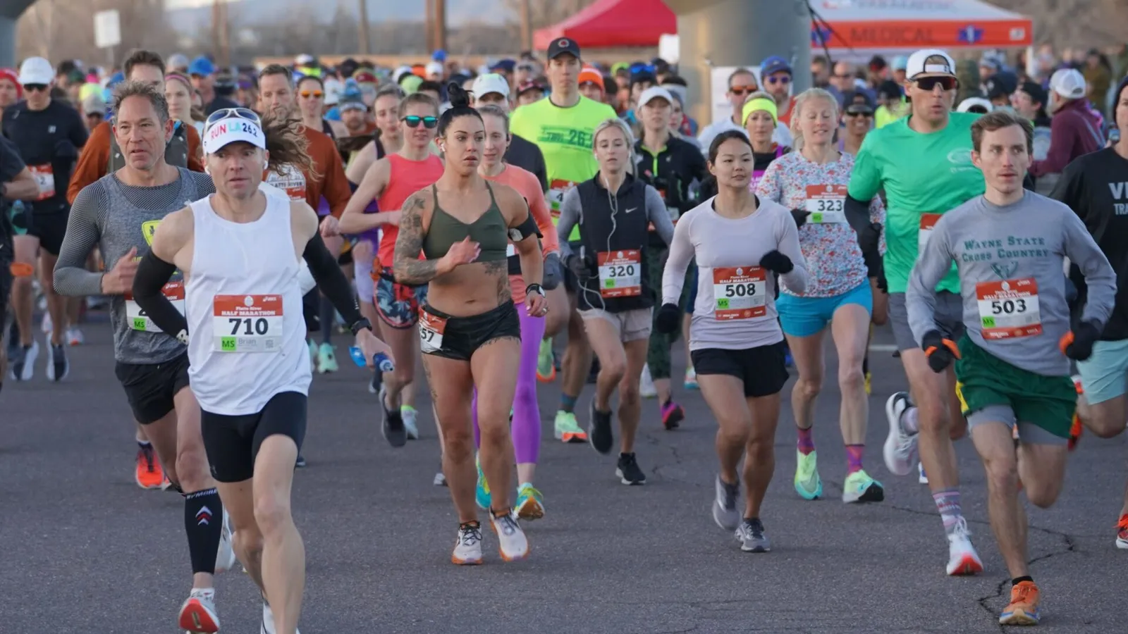 Runners in a pack at the start line of the Platte River Half Marathon Relay 5k.