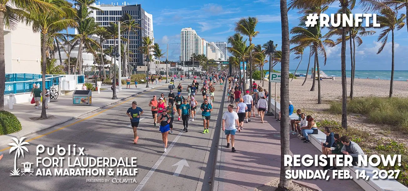 Runners participating in the Publix Fort Lauderdale A1A Marathon & Half Marathon on a sunny day with palm trees and the ocean in the background.