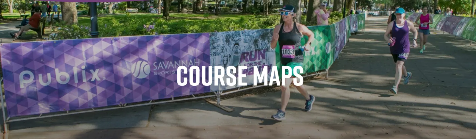 Runners on a paved path with trees and banners in the background, with the words "COURSE MAPS" overlaid in large white text.