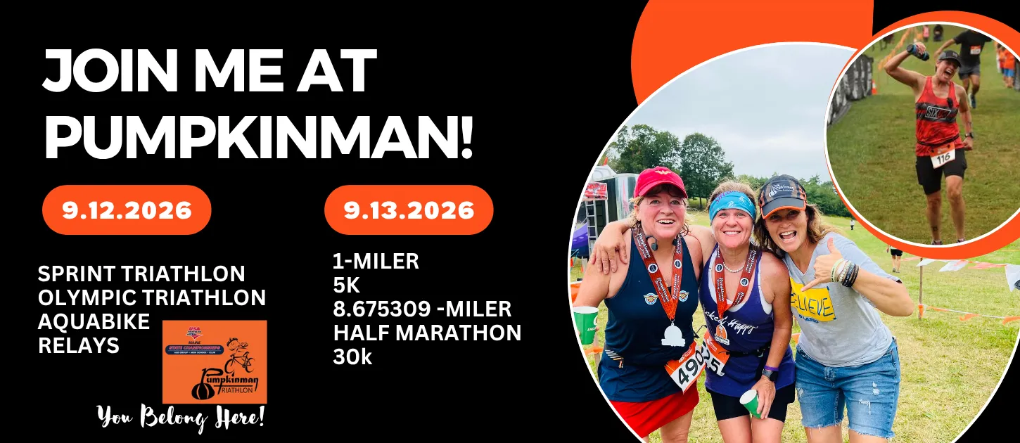 Three women with medals around their necks smiling and posing for a photo, with another runner in the background celebrating.