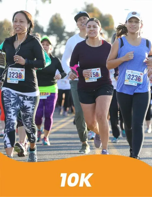 A group of diverse runners participating in a race, with bib numbers visible.
