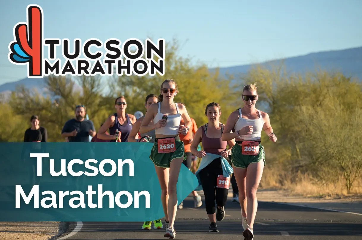 Runners participating in the Tucson Marathon, with the race logo and name prominently displayed.