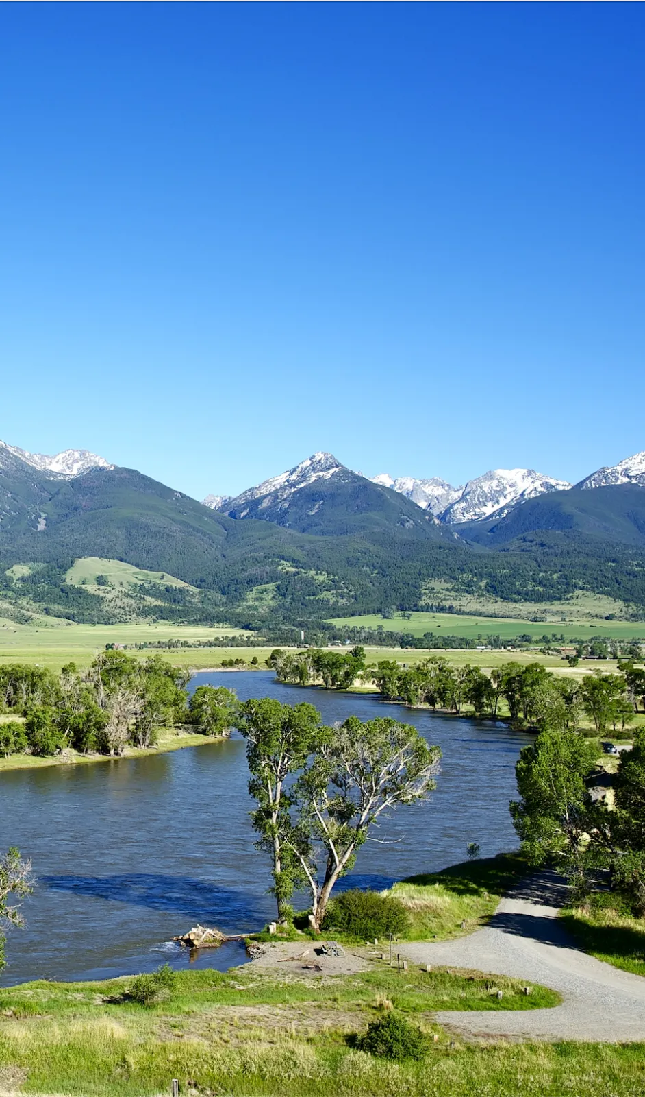 Scenic view of a river with mountains in the background.